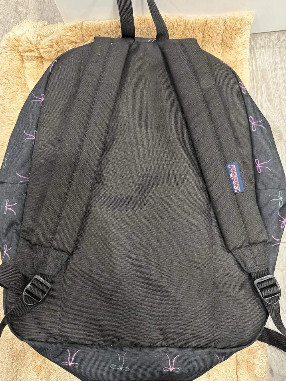 Jansport Black Backpack with Pink Bow Pattern and Heart Charm